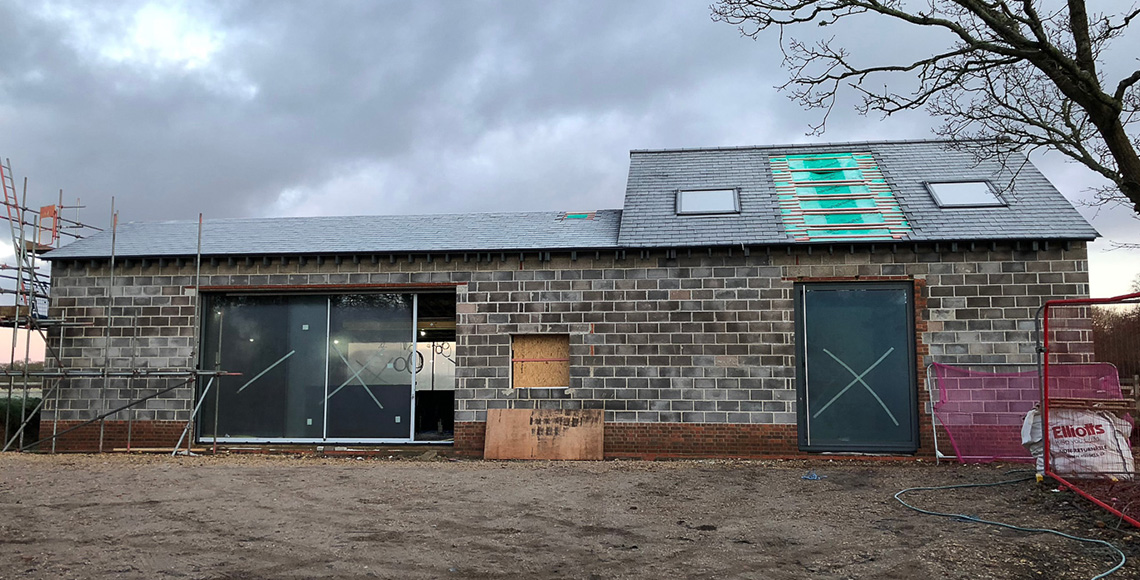 Construction of a luxury home in Ellingham Barns - a three-barn conversion project in Dorset, by INKSPACE Architects and Interiors