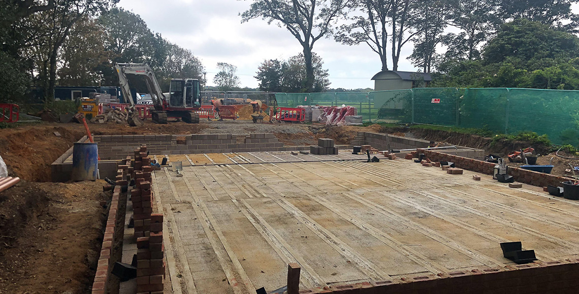 An old gym building and pool in the New Forest National Park area before being redesigned and renovated by INKSPACE Architects and Interior Designers