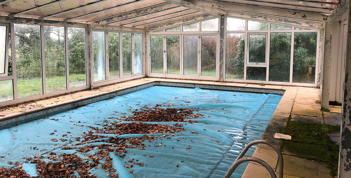 An old pool building in the New Forest National Park area before being redesigned and renovated by INKSPACE Architects and Interior Designers