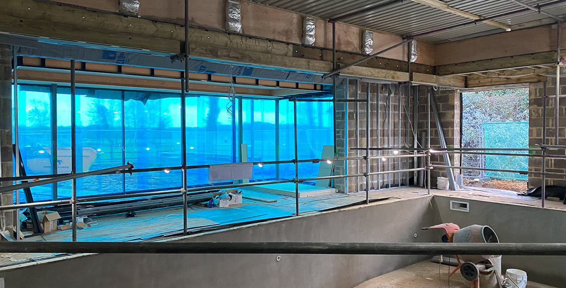 An old gym building and pool under construction in the New Forest National Park area being renovated by INKSPACE Architects and Interior Designers