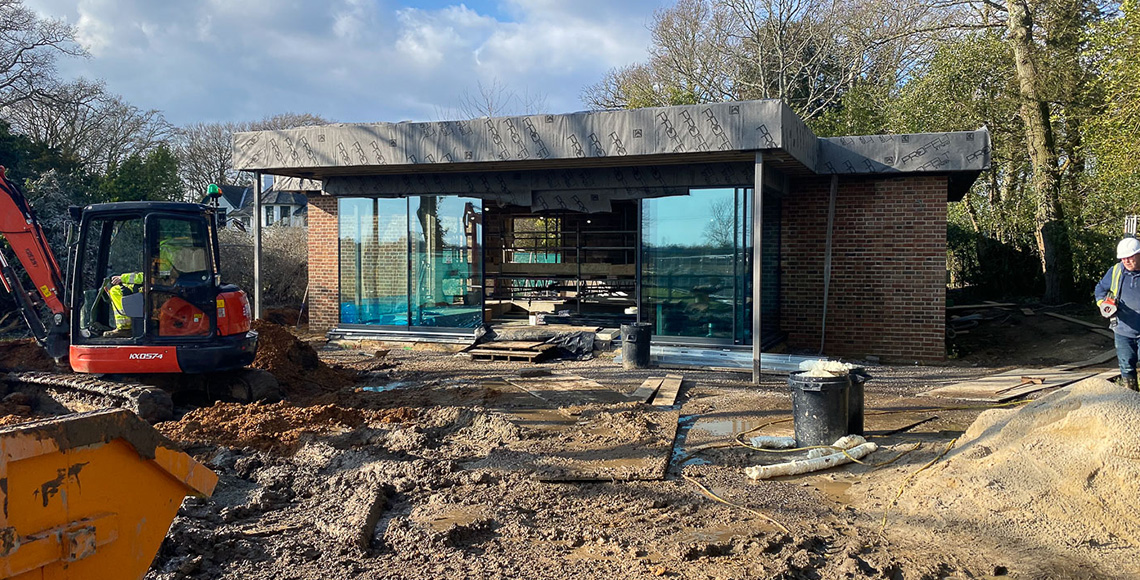 An old gym building and pool under construction in the New Forest National Park area being renovated by INKSPACE Architects and Interior Designers