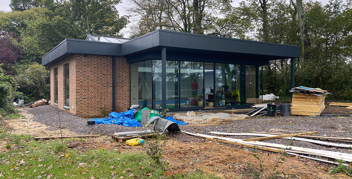 An old gym building and pool under construction in the New Forest National Park area. A renovation and reconstruction project by INKSPACE Architects and Interior Designers