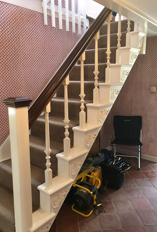 Staircase and hallway before being refurbished inside a Grade II listed house in Dorset, a restoration project by INKSPACE Architects and Interior Designers in Dorset, Cornwall and Devon
