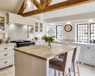 Luxury kitchen / dining area, with wooden ceiling beams, designed by INKSPACE, Interior Designers in Dorset, Devon and Cornwall